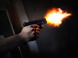 Shooting from the gun in the indoor hall